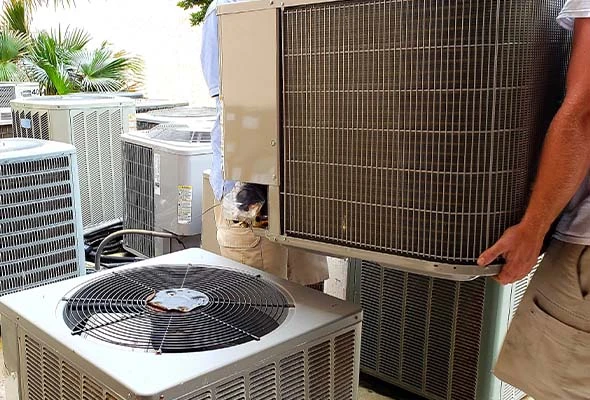HVAC technician installing a new energy-efficient air conditioning system at a home in Brooksville, Florida
