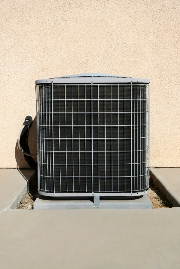 ac tuneup image Professional HVAC technician inspecting and cleaning condenser coils during an AC tune up in Florida